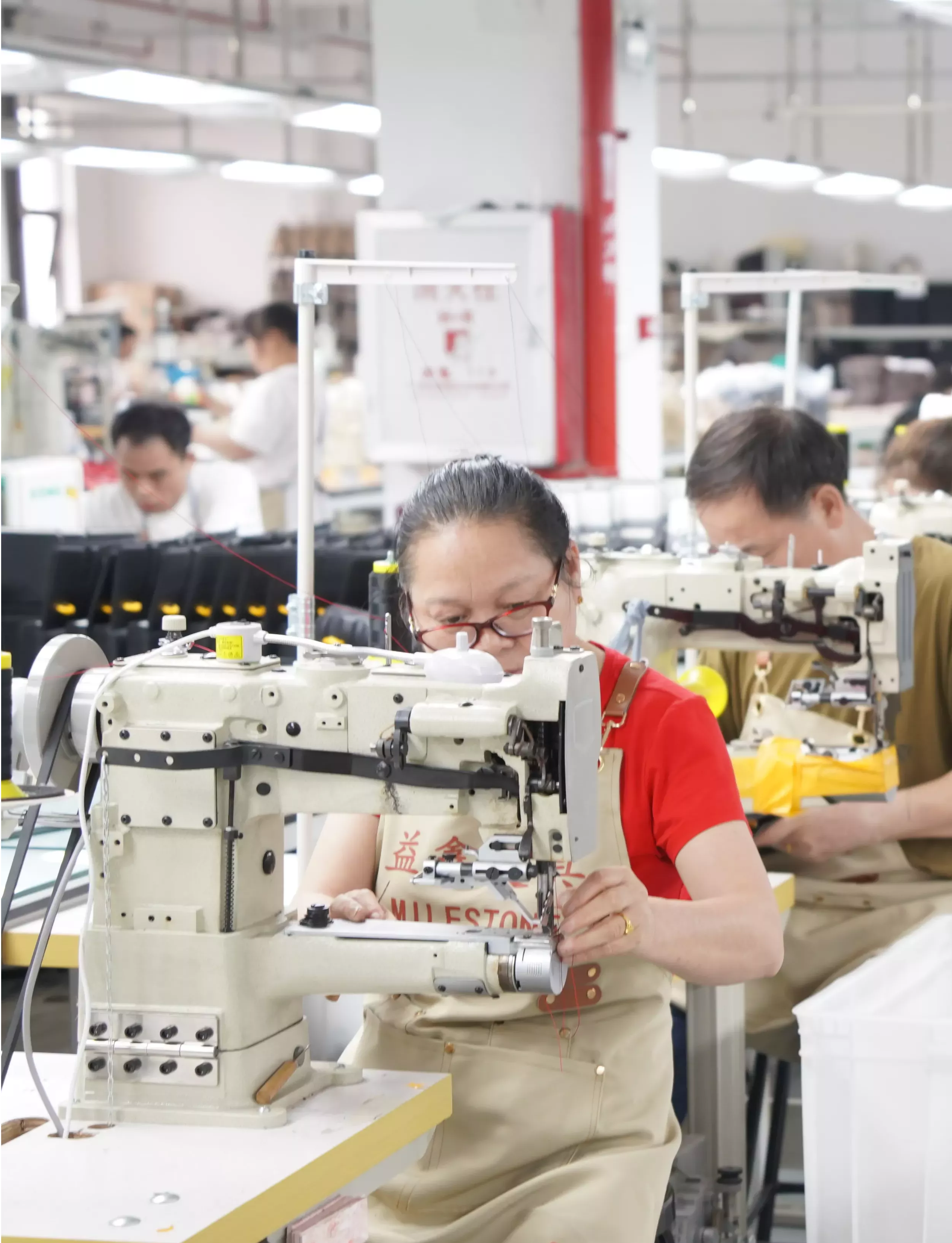 Seamstress Sewing in Milestone Factory